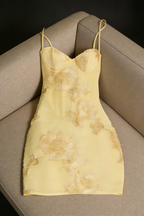 Nefertiti's Light Yellow 3D Floral Bob Paired With a Fitted Mini Dress