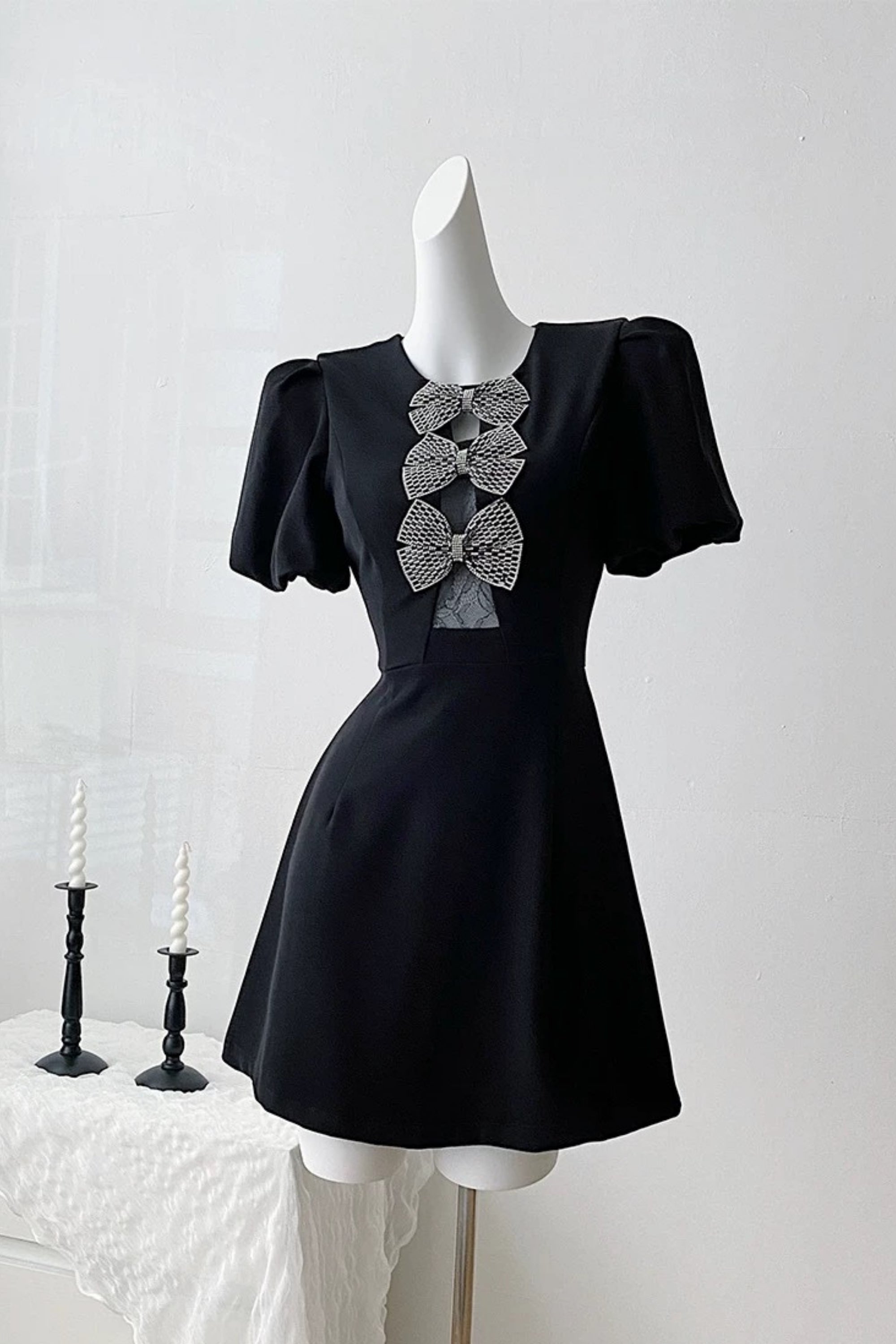 vanessa bow puff sleeve mini dress in black