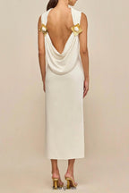 white sleeveless backless knit midi dress with two pleated golden embellishments