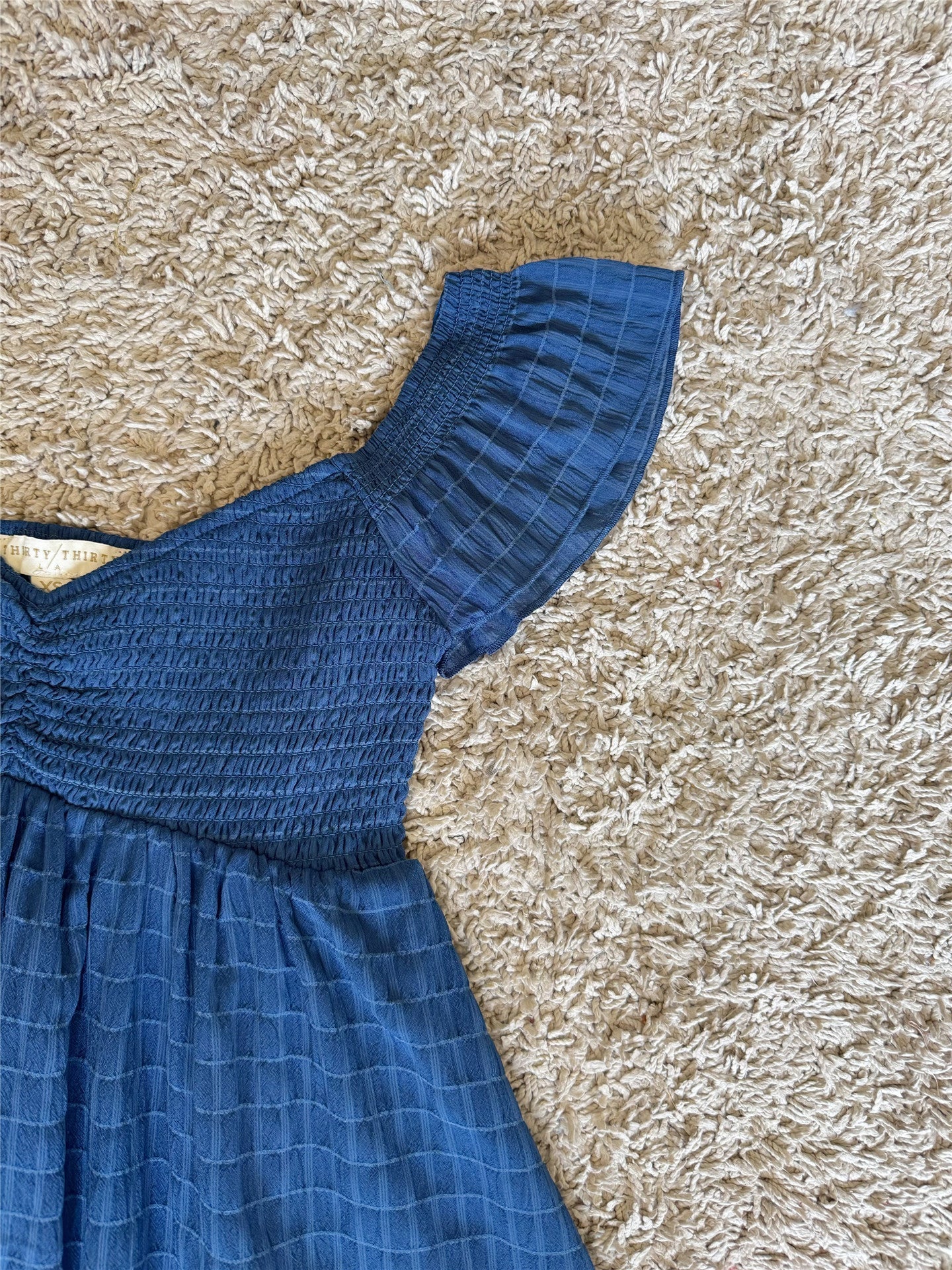 blue sleeveless V-neck mini dress