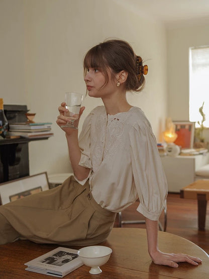 white embroidered cut-out  crew neck lantern sleeve shirt