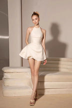 Elsa Pleated Backless Halter Mini Dress In Beige