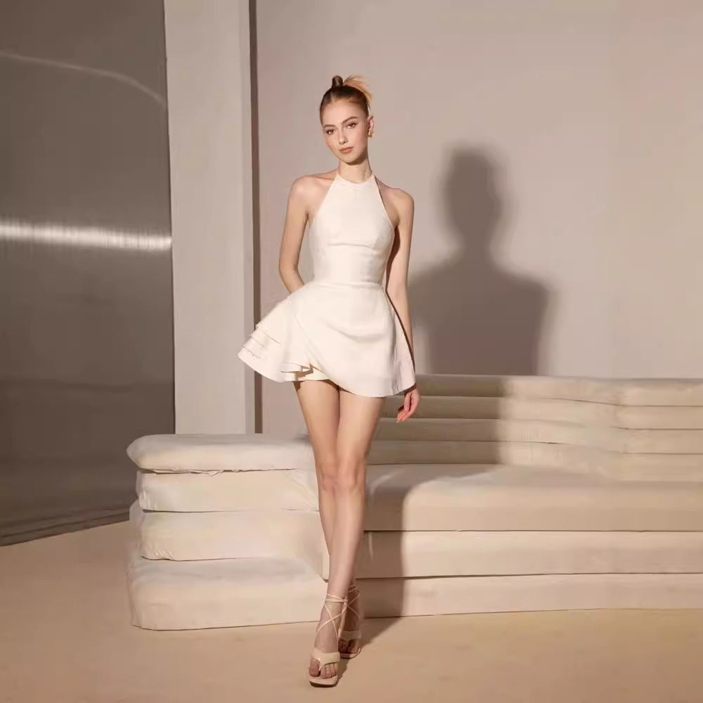 Elsa Pleated Backless Halter Mini Dress In Beige