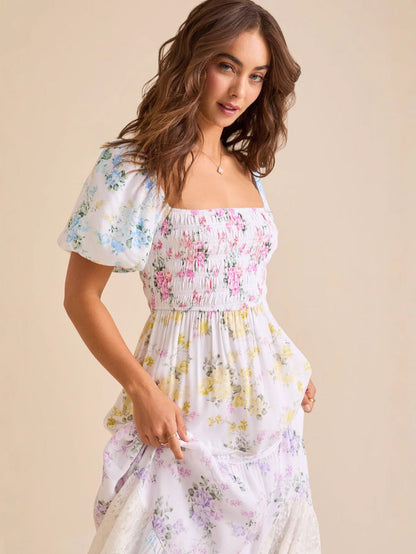 Puff-sleeved printed pleated lace strapless maxi dress
