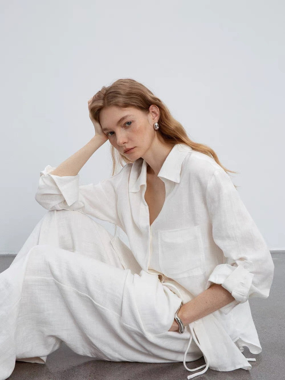 white V-neck linen long-sleeved shirt