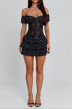 hedda Lace-trimmed polka dot strapless mini dress in black